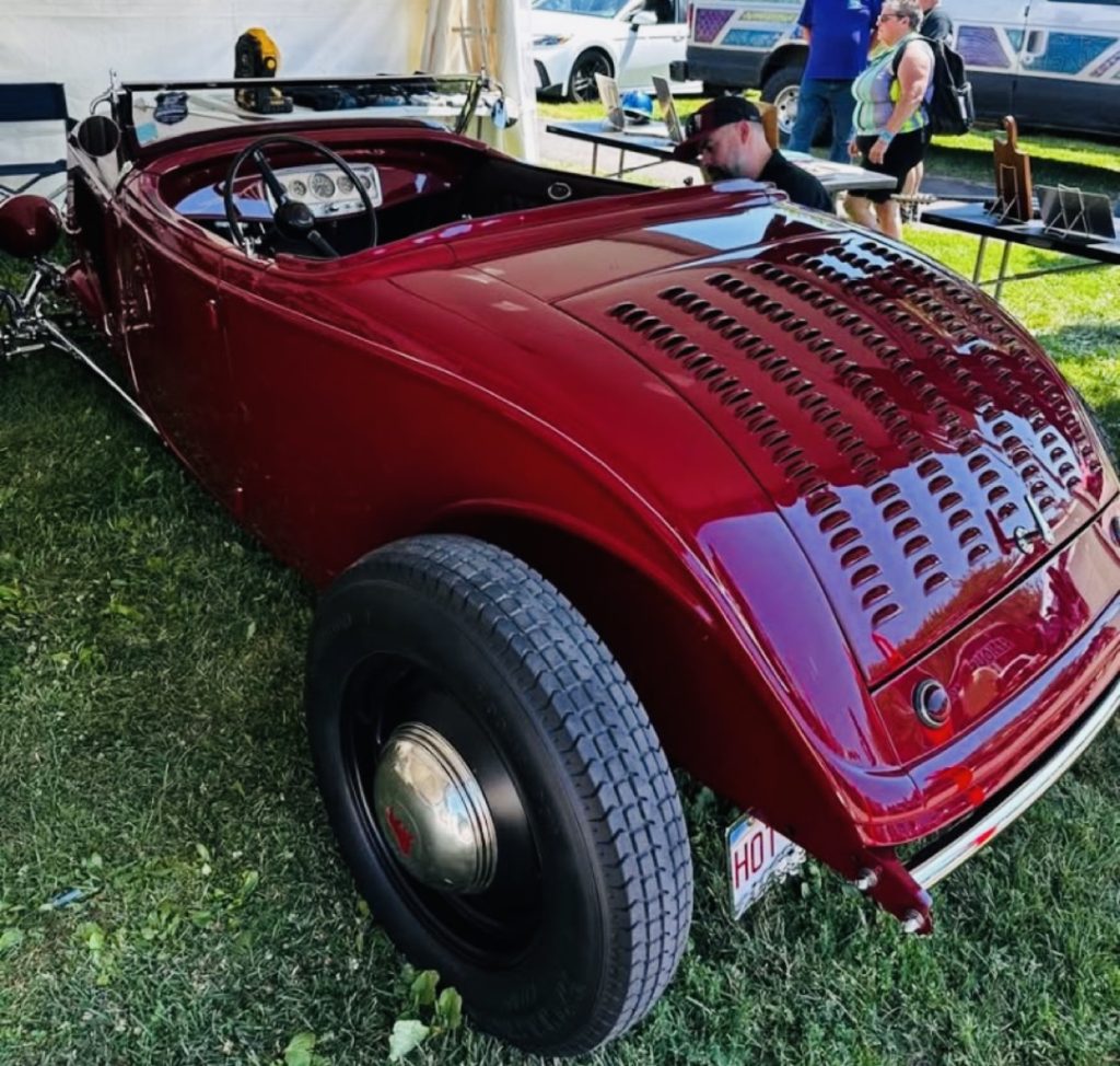 Red hot rod at a car show